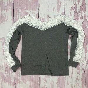 Long sleeve top with crocheted cutouts